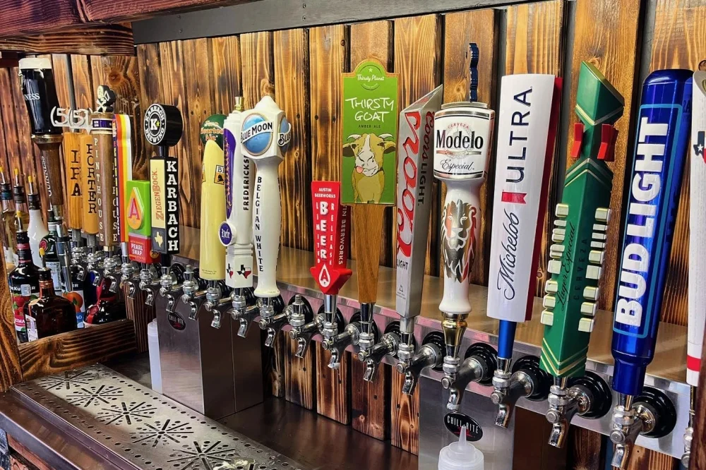 The actual tap handles and wood-paneled bar at The Victory Tap.