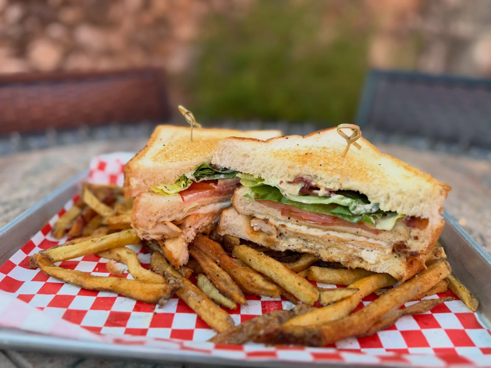 The Victory Tap’s grilled chicken club with house-cut fries.