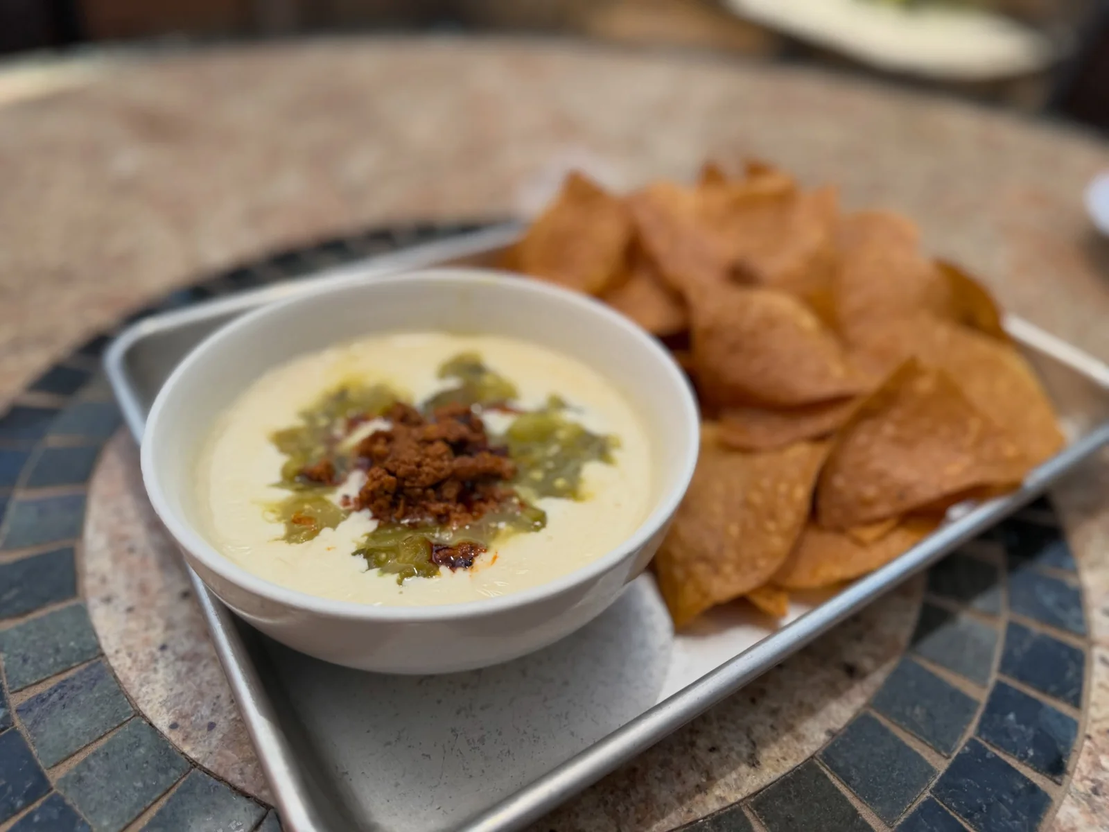 Queso and tortilla chips served at The Victory Tap.